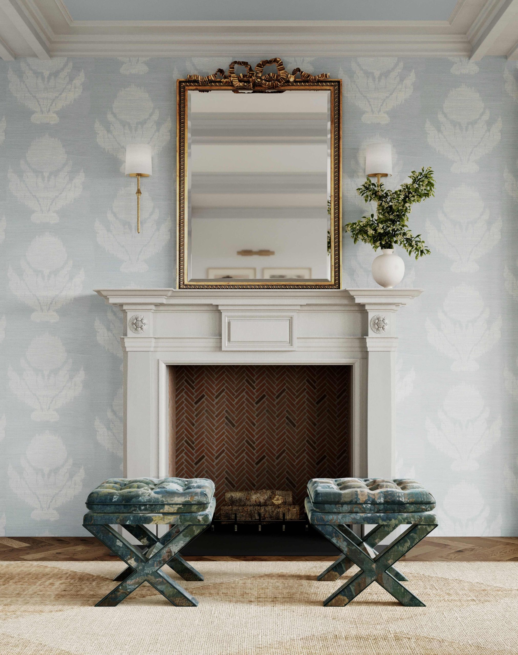 A white wood fireplace with a brick interior features a beveled gold mirror and a pair of sconces above the mantel, and two patterned x-base ottomans in front