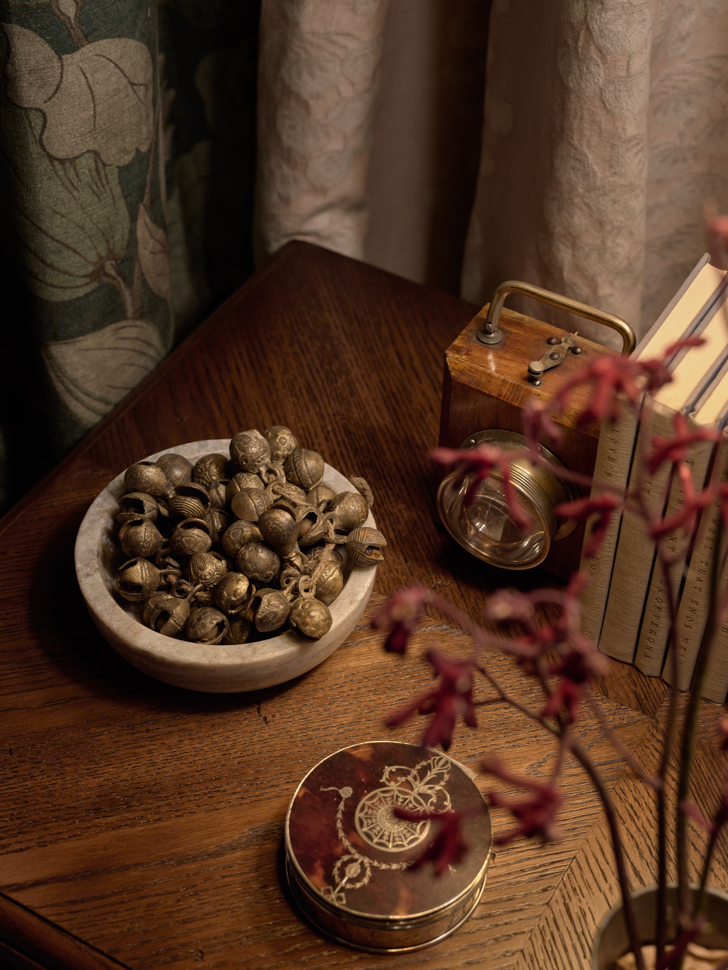 Decorative accents on a brown oak nightstand