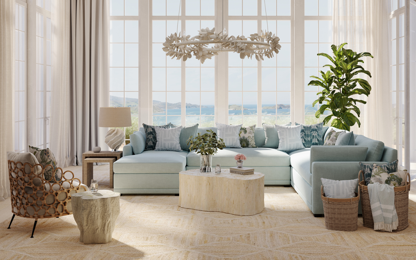 coastal living room with large blue sectional and natural jute rug