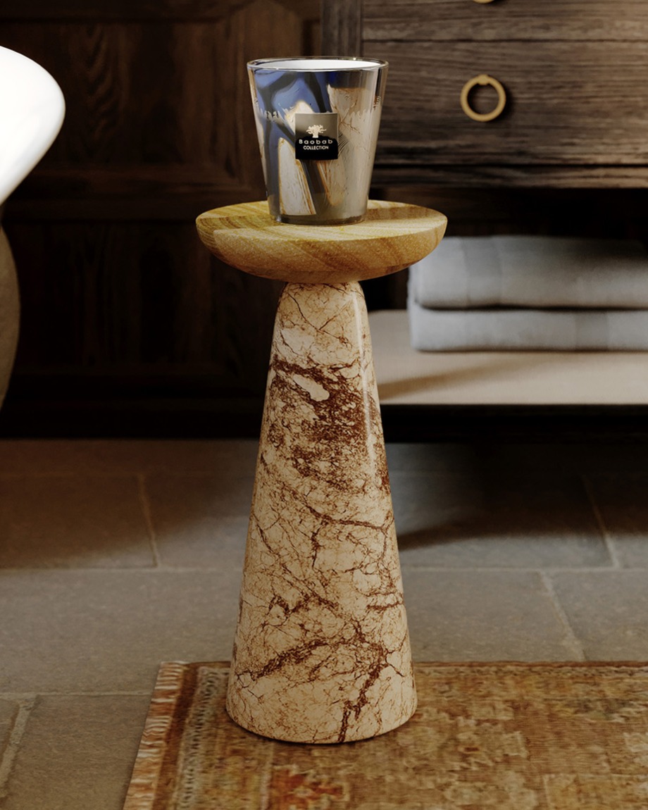 Baobab candle on top of a stone and wood drink table