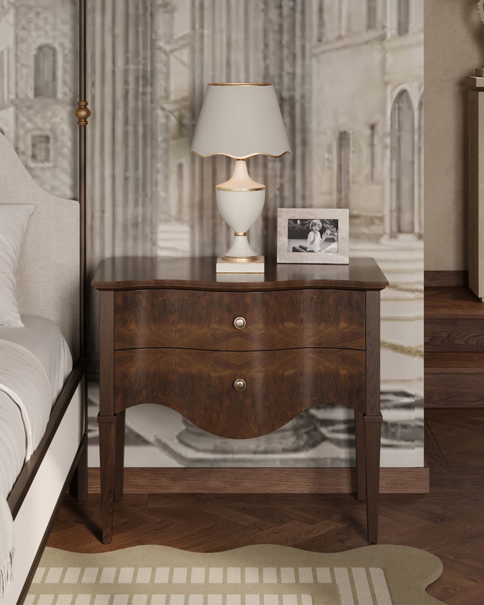 Walnut wood nightstand with curved edges and a white metal lamp on top
