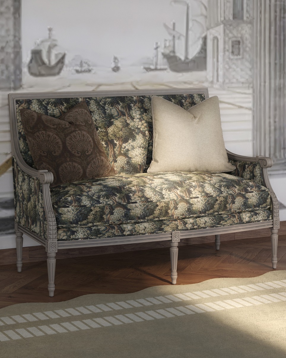 An upholstered settee with tapestry fabric sits in an Italian bedroom